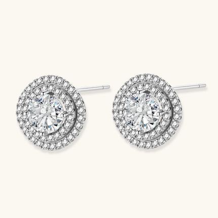 Double halo sterling silver stud earrings with brilliant round moissanite center stones and pavé crystal accents