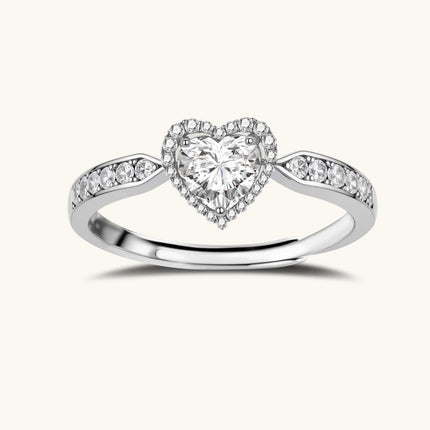Complete jewelry set with heart-shaped sterling silver pieces featuring brilliant moissanite stones on white background.