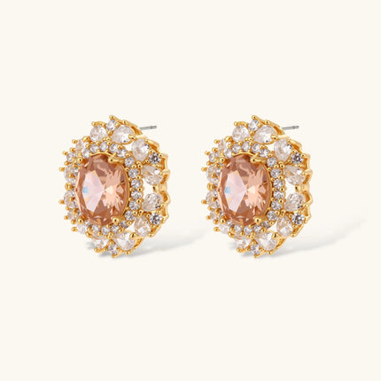 Ornate gold-plated jewelry set featuring peach center stone surrounded by clear AAA cubic zirconia crystals