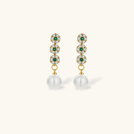 Gold-plated jewelry set with green cubic zirconia floral motifs, featuring matching necklace and pearl drop earrings