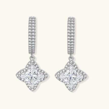 Sterling silver huggie hoops with geometric diamond-shaped moissanite dangles featuring pavé crystal details