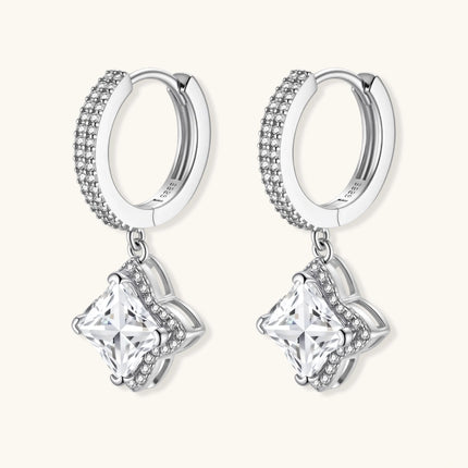 Sterling silver huggie hoops with geometric diamond-shaped moissanite dangles featuring pavé crystal details