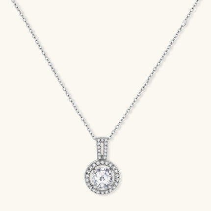Platinum-plated sterling silver necklace with round halo pendant featuring central crystal surrounded by smaller stones