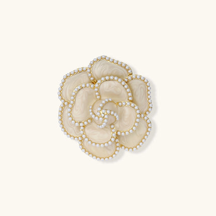 Elegant cream-colored rose brooch with gold plating, zirconia stones, and pearl-like border details on neutral background.