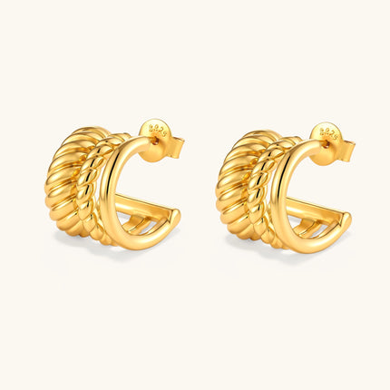 Gold-plated sterling silver triple hoop huggie earrings with rope-twist and smooth band details, shown from front and side.