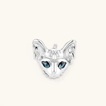 3D sculpted stainless steel Sphynx cat head stud earring with blue CZ eyes and hoop ear details, silver finish.