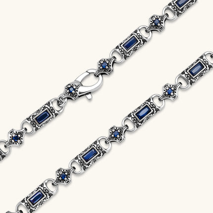 Oxidized silver 316L stainless steel chain necklace with rectangular navy CZ links and ornate gothic connector pieces, 640mm.