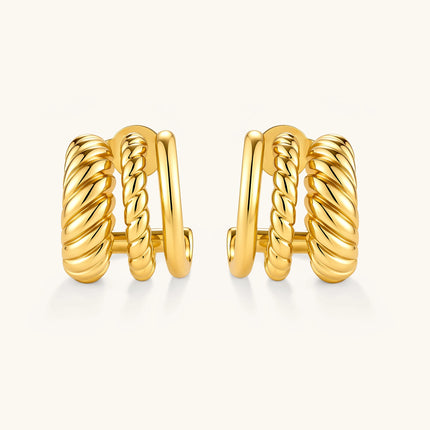 Gold-plated sterling silver triple hoop huggie earrings with rope-twist and smooth band details, shown from front and side.